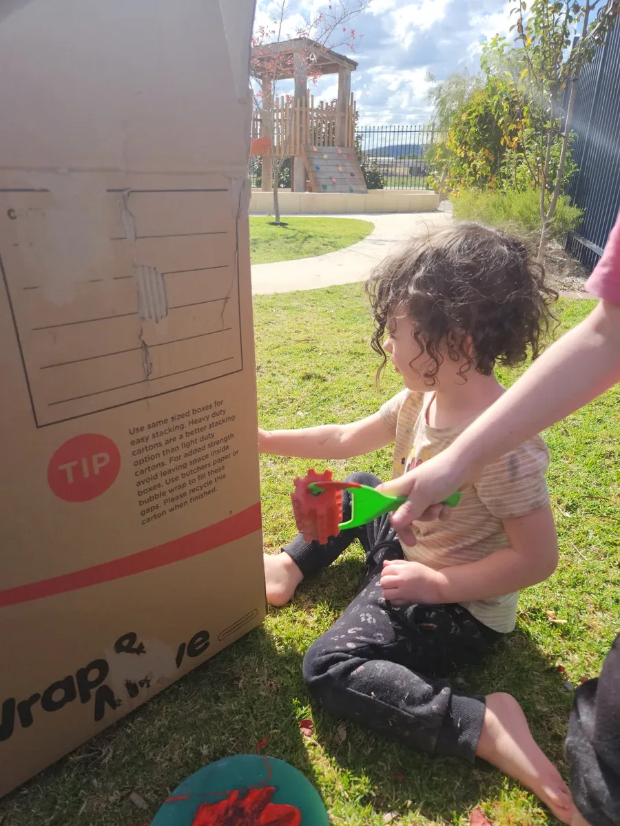 Children exploring a colours-of-the-world activity at Sonas Gosnells