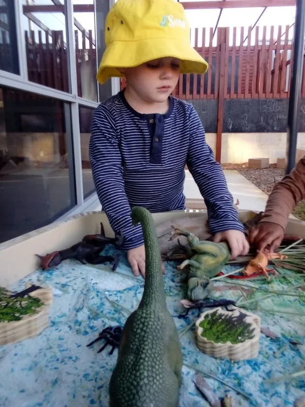 Children exploring dinosaurs at Sonas Spearwood