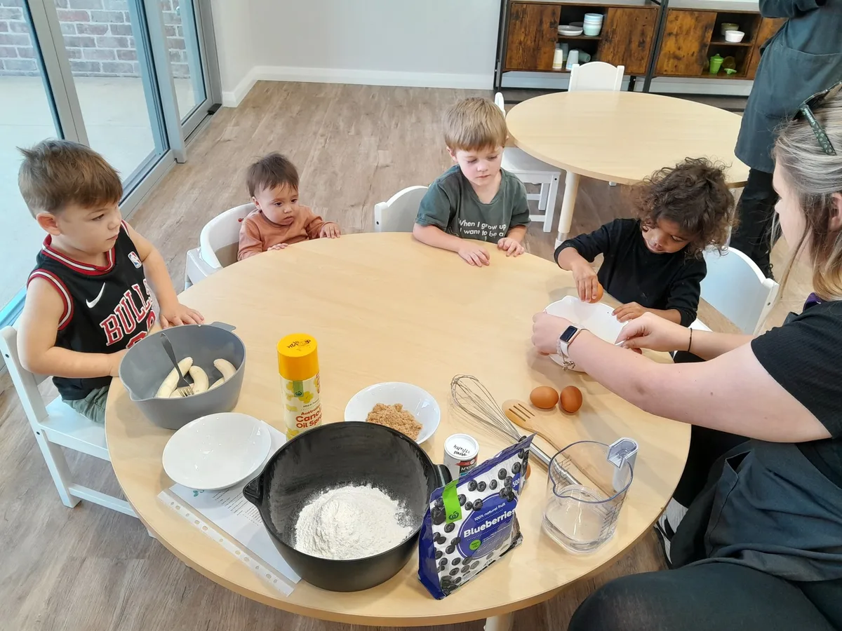 Children in Kids-in-the-Kitchen cooking program at Sonas Spearwood