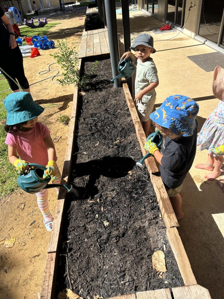 Sonas Atwell – Planting Seeds in our Garden Beds